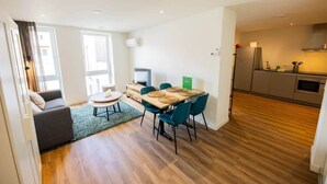 A modern apartment with a dining area, kitchen, and living space. - Divine 50m2 Apartment (WE-39-D) (Tiel)