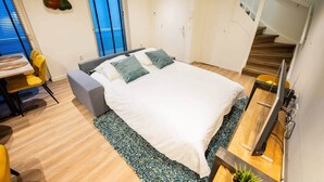 A modern bedroom with a bed, a desk, and a chair. - Friendly 50m² Apartment with Terrace (WE-39-A) (Tiel)