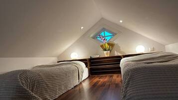 1 bedroom, desk, iron/ironing board, travel crib