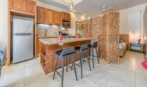 Fridge, microwave, stovetop, coffee/tea maker