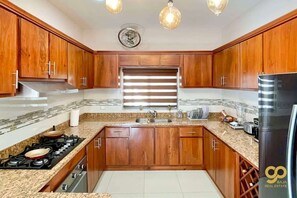 Fridge, microwave, oven, stovetop - Cozy Home with Private Patio, Near Malecón & WiFi (La Paz)