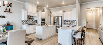 Relax & enjoy large private backyard with pool, hot tub & golf green!