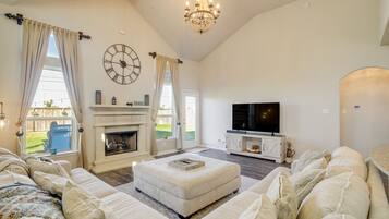 TV, fireplace, books