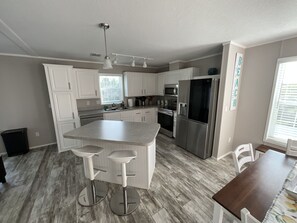 Microwave, oven, stovetop, dishwasher - Canal home in South Naples FL (Naples)