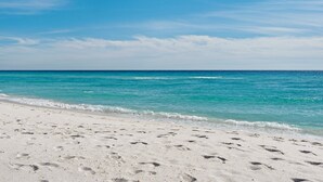 A sandy beach with footprints leading to the water. - 4BR w/2 Master Suites, Golf Cart, .3 Mi to Beach, Sleeps 15 + Free Tickets! (Santa Rosa Beach)