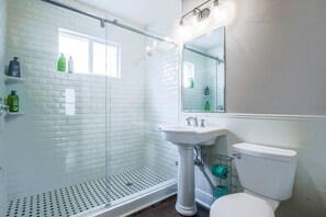 Shower, eco-friendly toiletries, hair dryer, towels