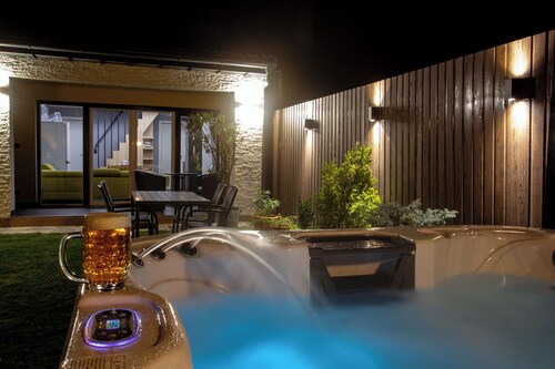 Duplex semi-detached home with private garden bar and hot tub