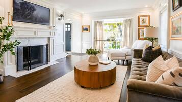 Smart TV, fireplace, books, printers