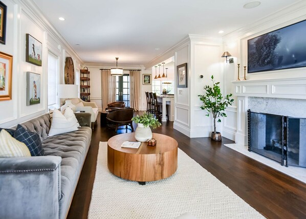 Smart TV, fireplace, books, printers