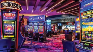 A casino with slot machines and a large sign displaying $20,018.40. - Perfect Palm Springs Studio Retreat Near Downtown!
 (Palm Springs)