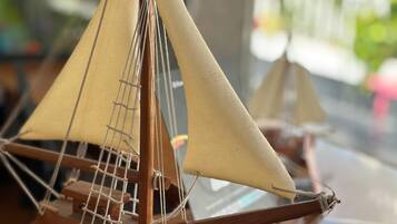 A model sailboat on a wooden base with the inscription "Santa Maria."