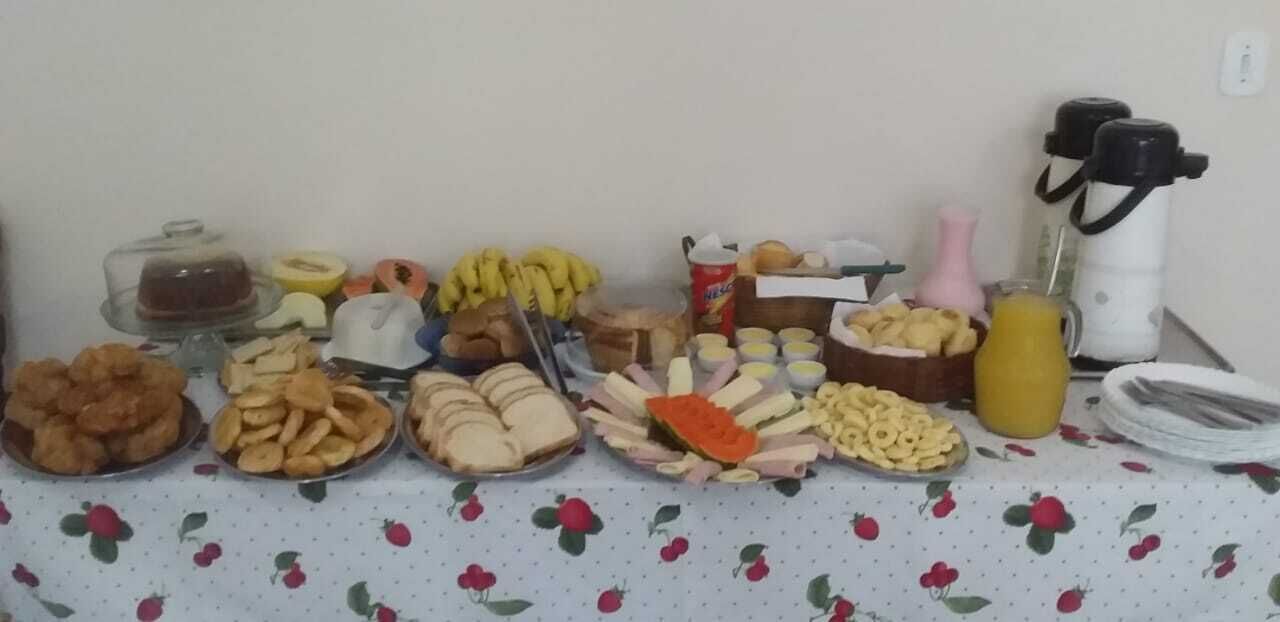 A buffet table with various food items and beverages.