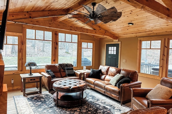 This great room features brand new leather furniture, expansive windows, and a rustic stone fireplace with gas insert. This room flows right into the kitchen so it's an easy spot for everyone to gather.
