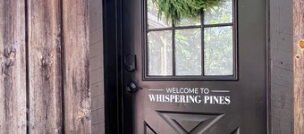 Cozy 2BR/2BA cabin tucked in the trees with hot tub, fire pit, covered deck, and fast WiFi.