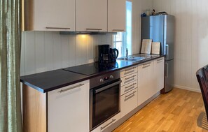 Fridge, stovetop, dishwasher, coffee/tea maker