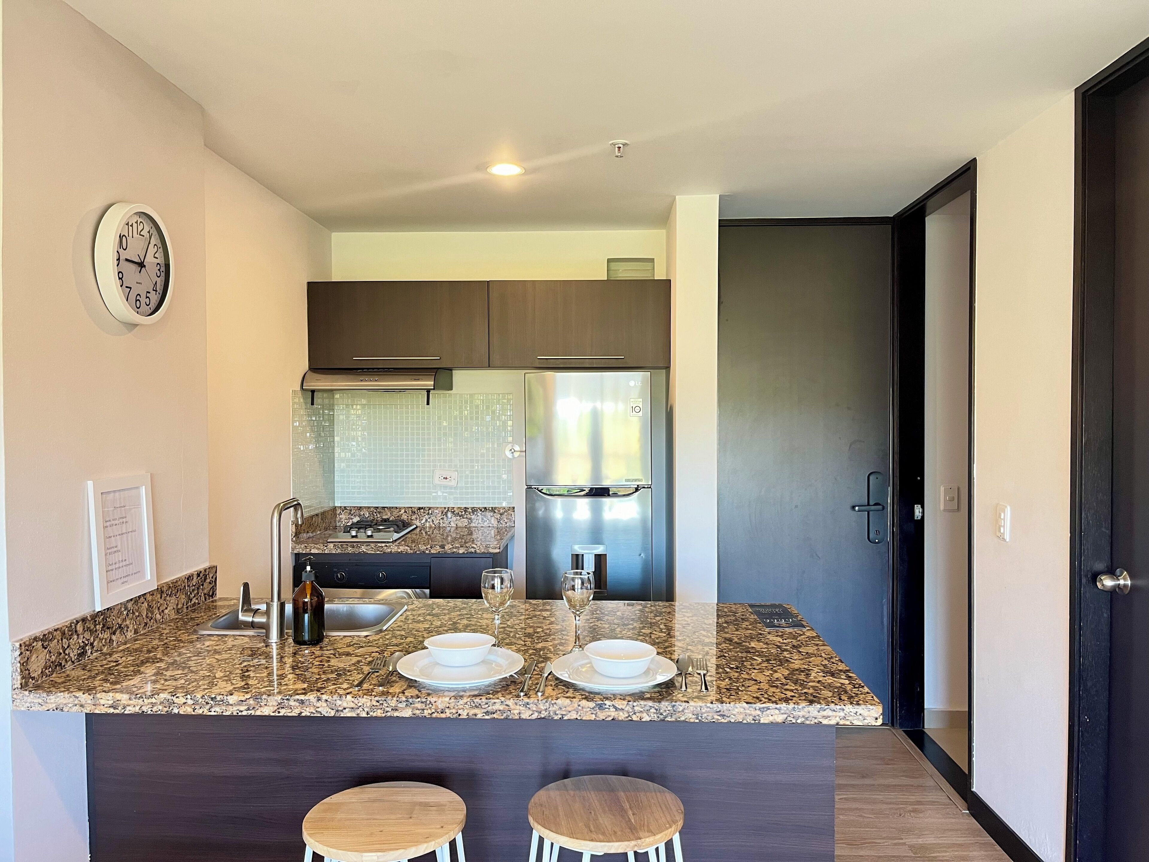 panoramic suite | private kitchen | fridge, cookware/dishes/utensils, cleaning supplies, kitchen islands