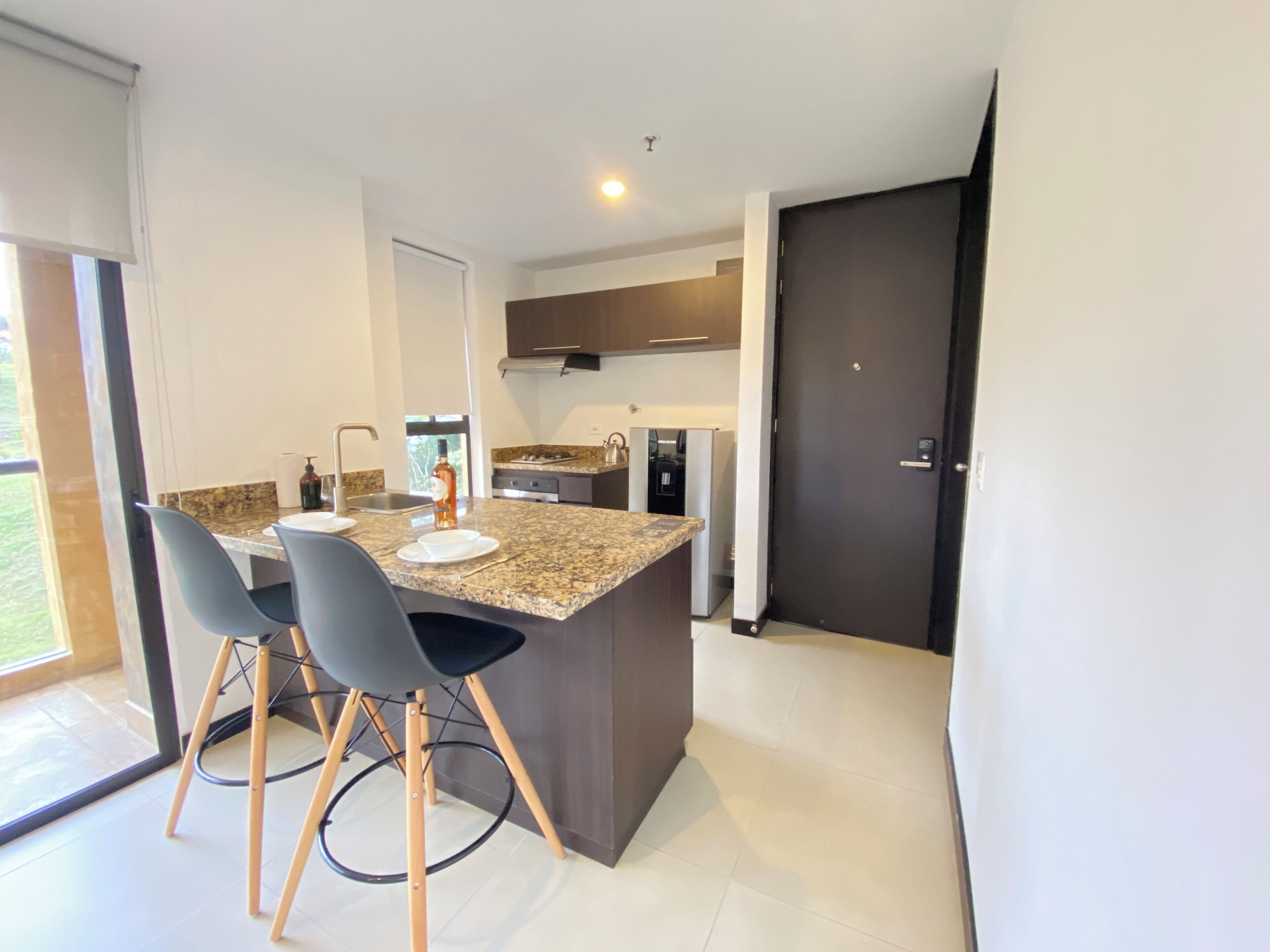 business studio suite | private kitchen | fridge, cookware/dishes/utensils, cleaning supplies, kitchen islands