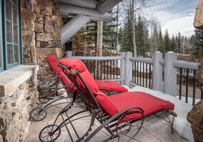 Relax on the private patio with loungers, rocking chairs, a grill, and dining seating for six. - Charlie's Slopeside: Bear Paw, Ski-In/Out, Sleeps 8, Bachelor Gulch + Ritz Pool & Hot Tub Access (Beaver Creek)