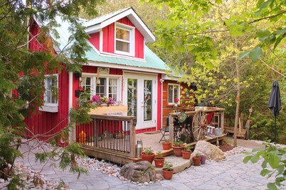 Gorgeous cozy cottage besides a bustling stream, surrounded by gorgeous greenery