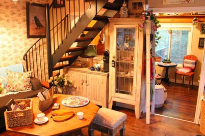 Gorgeous cozy cottage besides a bustling stream, surrounded by gorgeous greenery