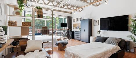 1 bedroom, desk, iron/ironing board, travel crib