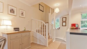 A modern kitchen with a red microwave, a wooden bowl, and a window with a view of greenery. - Herdwick Place, spacious cottage for 4 in spectacular Langdale Valley (Great Langdale)