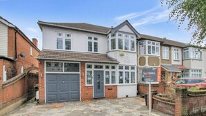 A two-story house with a garage, a stone-paved driveway, and a 'For Sale' sign. - Stunning 4-Bed House in Gidea Park (Romford)