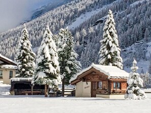 A snow-covered lodge with a wooden exterior and a sign reading "Stadel". - Häuschen Stadel by Interhome (Saas-Grund)