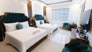 Habitación cuádruple familiar | Ropa de cama de alta calidad, minibar, escritorio y insonorización