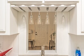 A bathroom with a white sink, a mirror, and a shower area. - 2BD/2BR Near Sac FolsomRoseville (Sacramento)
