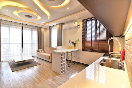 Premium Apartment, 2 Bathrooms | Living area | 50-inch Smart TV with digital channels, Netflix, streaming services