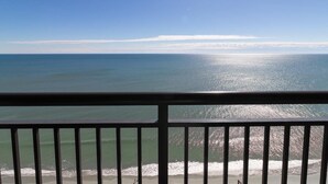 A balcony with a view of the ocean and beach. - Above the Waves 21st Floor Oceanfront 3 Bedroom (Myrtle Beach)