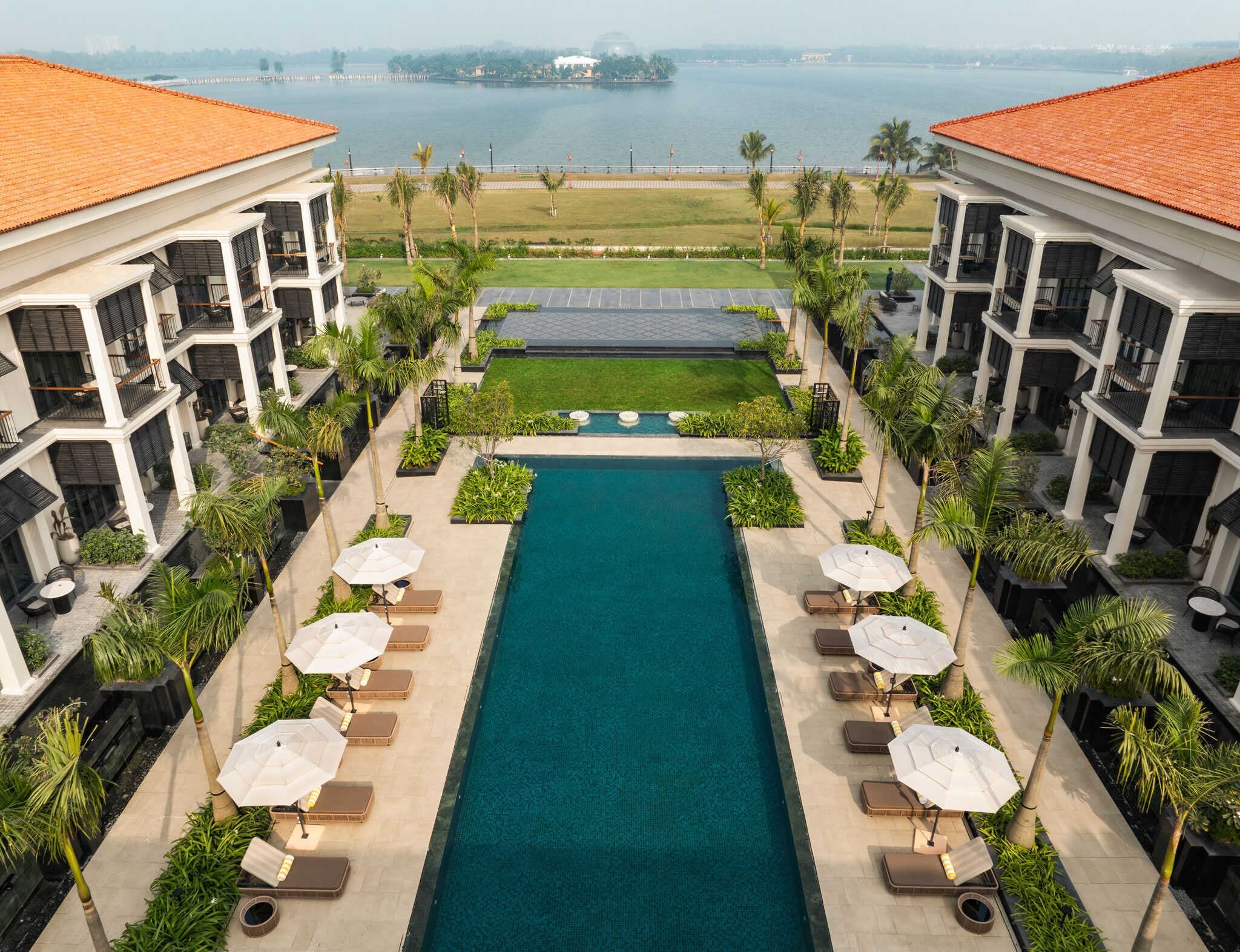 Outdoor pool, open 8:00 AM to 9:00 PM, pool umbrellas