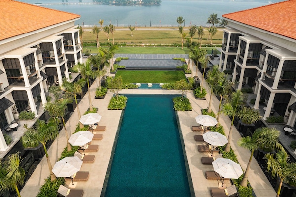 Outdoor pool, open 8:00 AM to 9:00 PM, pool umbrellas