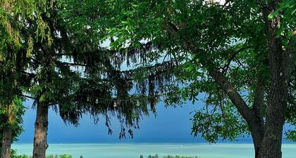 A charming country house with separate guest rooms overlooking the lake.