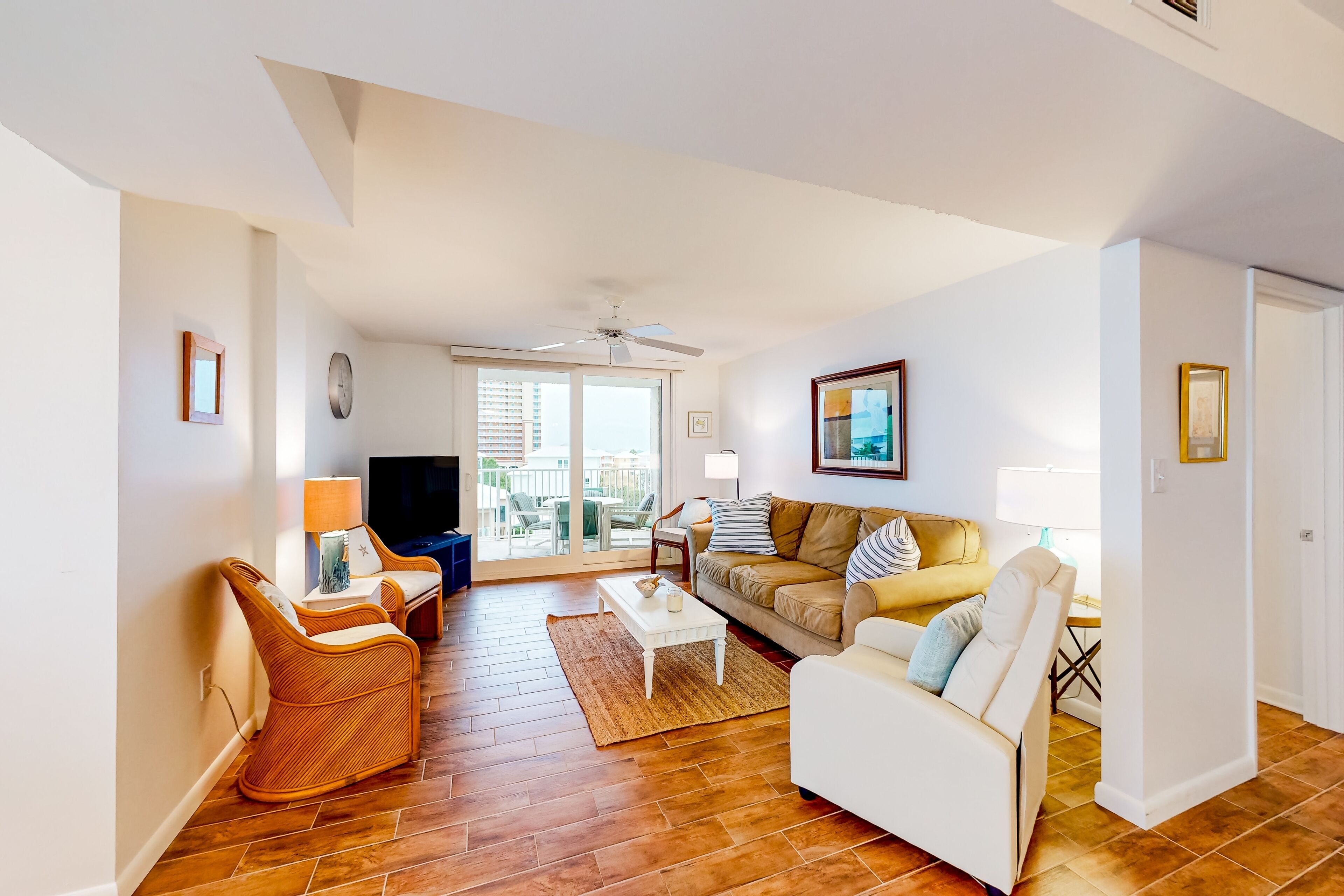 Lagoon view condo with modern updates, pool access, balcony, W/D, and AC