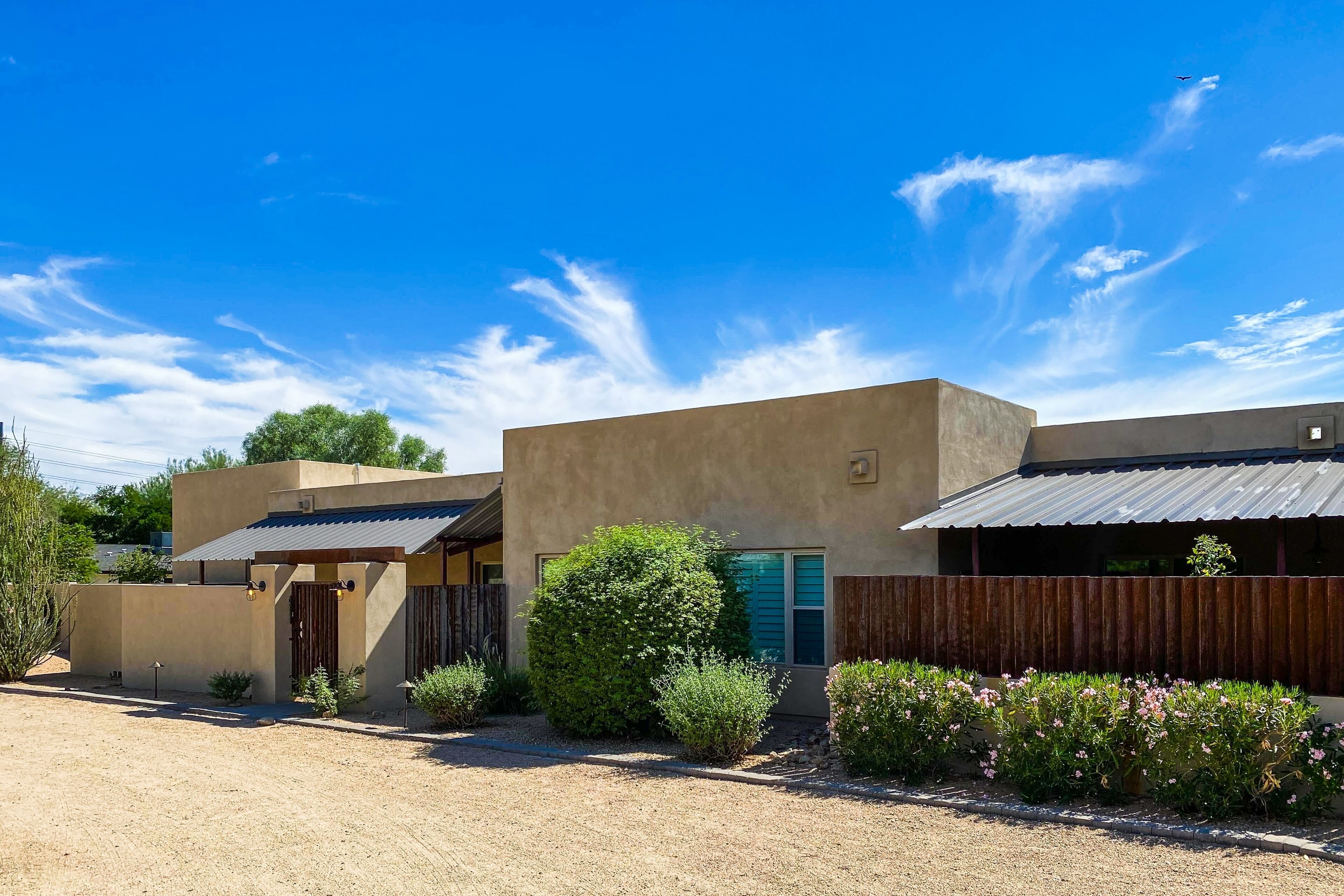 Luxe desert retreat with a pool, outdoor kitchen, basketball court, & game room