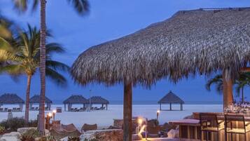 On the beach, sun loungers, beach towels