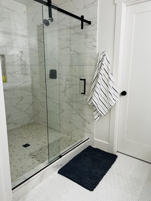 Shower, hair dryer, towels, soap