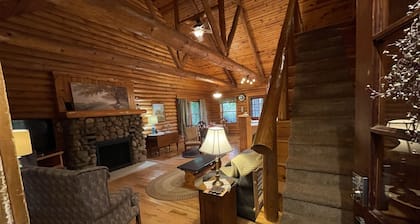 Beautiful log cabin with all the creature comforts of home. Private fishing lake