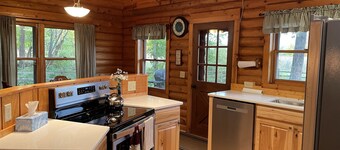 Beautiful log cabin with all the creature comforts of home. Private fishing lake