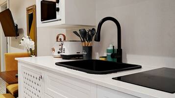 Fridge, microwave, stovetop, coffee/tea maker