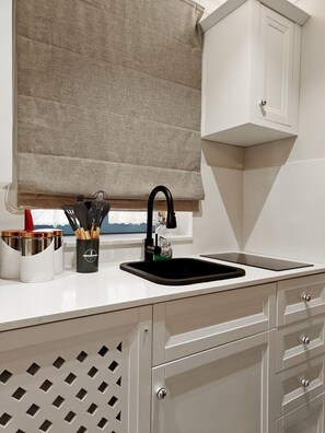 Fridge, microwave, stovetop, coffee/tea maker