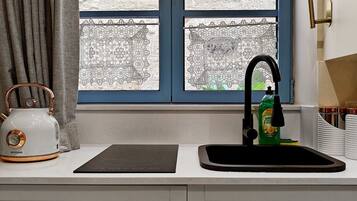 Fridge, microwave, stovetop, coffee/tea maker