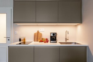 Fridge, stovetop, coffee/tea maker, cookware/dishes/utensils