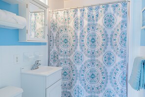 Hair dryer, towels, soap, shampoo