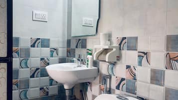 Shower, towels, shampoo, toilet paper