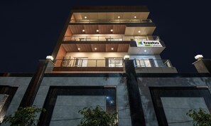 A multi-story hotel with a modern design, featuring balconies and a prominent signage for 'treebo trend La Mirage Suite'. - Treebo La Mirage Suite (Noida)