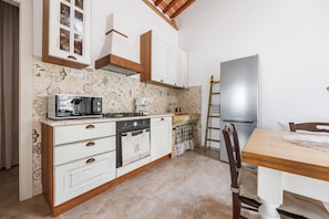 Villa | Private kitchen | Full-sized fridge, microwave, oven, stovetop