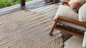 A balcony with a view of the sea, wooden furniture, and potted plants. - Flamingo House • ISLA • Sunset view • Walk to town (Cruz Bay)